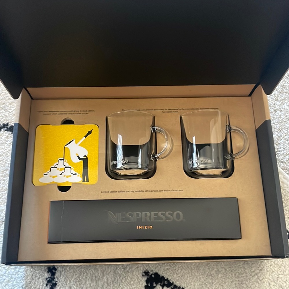 Vertuo nespresso coffee mugs with Nespresso capsules and two coasters